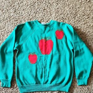 Green Sweatshirt with Red Apple Design